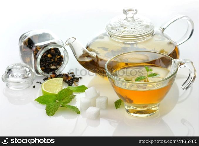 green tea composition with teapot,cup ,lime and peppermint