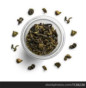 Green tea lies in a circle on a white background. The view from the top.. Green tea lies in a circle on a white background. The view from the top