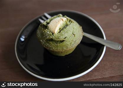 Green tea Muffin on wood