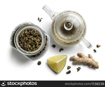 Green tea, teapot, ginger and lime on a white background. The view from the top.. Green tea, teapot, ginger and lime on a white background. The view from the top