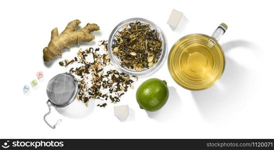 Green tea with aromatic additives and accessories. Top view on white background.. Green tea with aromatic additives and accessories. Top view on white background