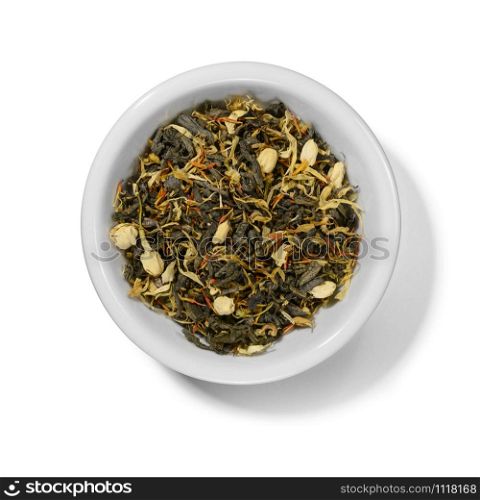 Green tea with aromatic additives. Top view on white background.. Green tea with aromatic additives. Top view on white background