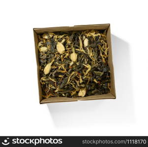 Green tea with aromatic additives. Top view on white background.. Green tea with aromatic additives. Top view on white background