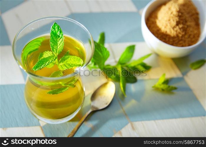 green tea with mint Moroccan style on wood blue white table