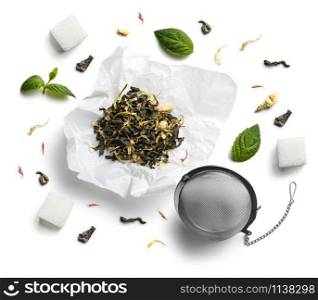 Green tea with natural aromatic additives. Top view on white background.. Green tea with natural aromatic additives. Top view on white background