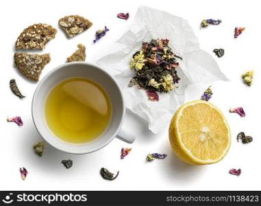 Green tea with natural aromatic additives. Top view on white background.. Green tea with natural aromatic additives. Top view on white background