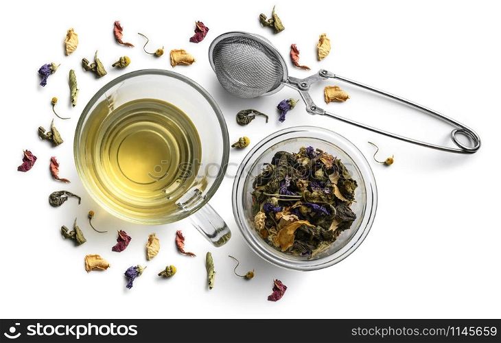 Green tea with natural flavors and a cup. Top view on white background.. Green tea with natural flavors and a cup. Top view on white background