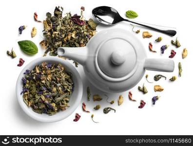 Green tea with natural flavors and a teapot. Top view on white background.. Green tea with natural flavors and a teapot. Top view on white background