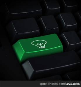 Green Technology. Computer keyboard with green Enter key with recycling symbol business concept