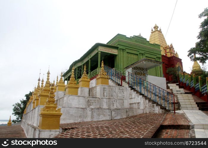 Green temple on the top of Sagaing hill near Mandalay, Myanmar