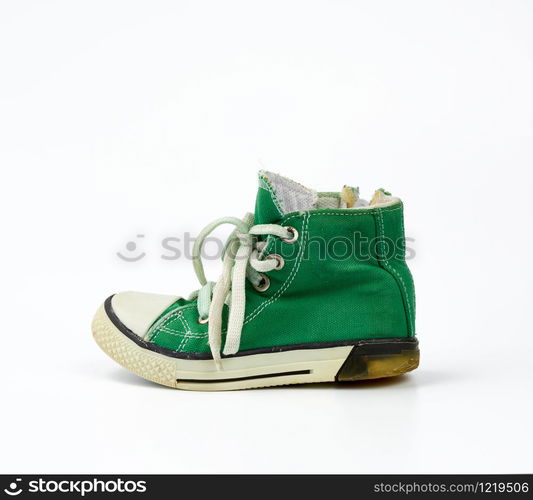 green textile sneaker with white tied shoelaces on a white background, shoes are sideways