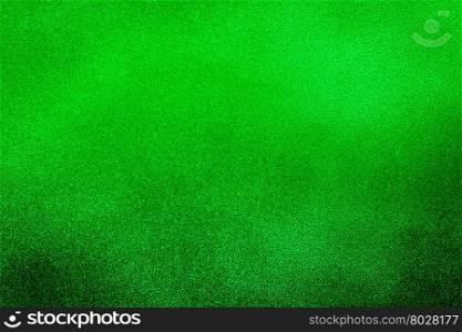 Green texture background with bright center spotlight