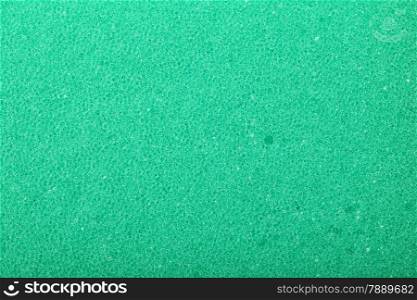 Green texture cellulose foam sponge - background.