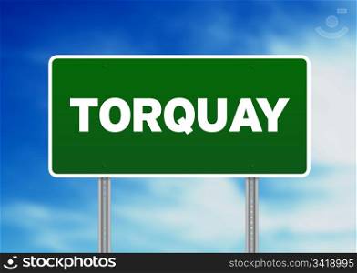 Green Torquay, England highway sign on Cloud Background.