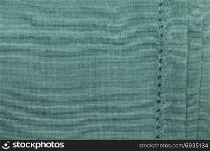 Green towel fabric. Tablecloth texture. Cotton texture closeup, background
