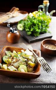 Green vegan salad with sunflower seeds. Healthy vegetarian food concept.