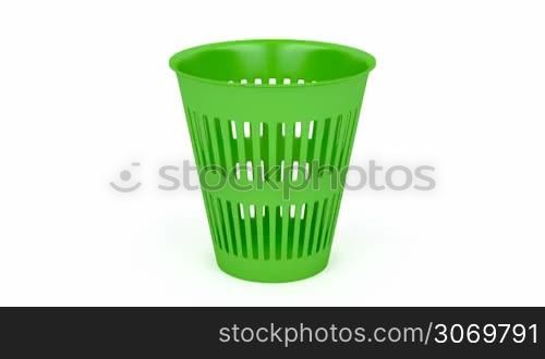 Green waste basket on white background