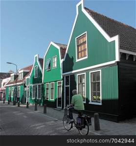 Green wooden houses in Krommenie in Noord-Holland in the Netherlands