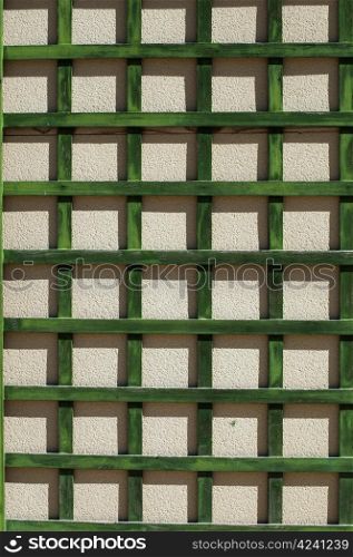 Green wooden lattice wall.