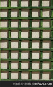 Green wooden lattice wall.