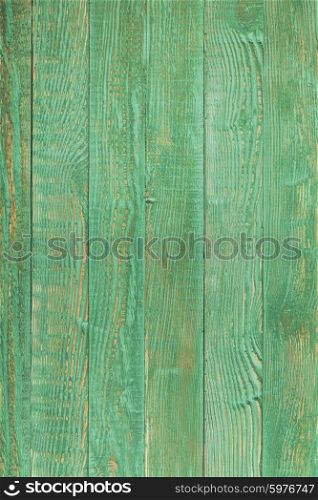 Green wooden wall, painted in shabby chic style