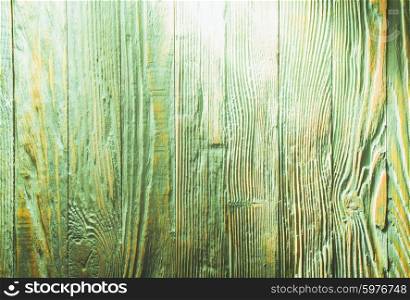Green wooden wall, painted in shabby chic style and light
