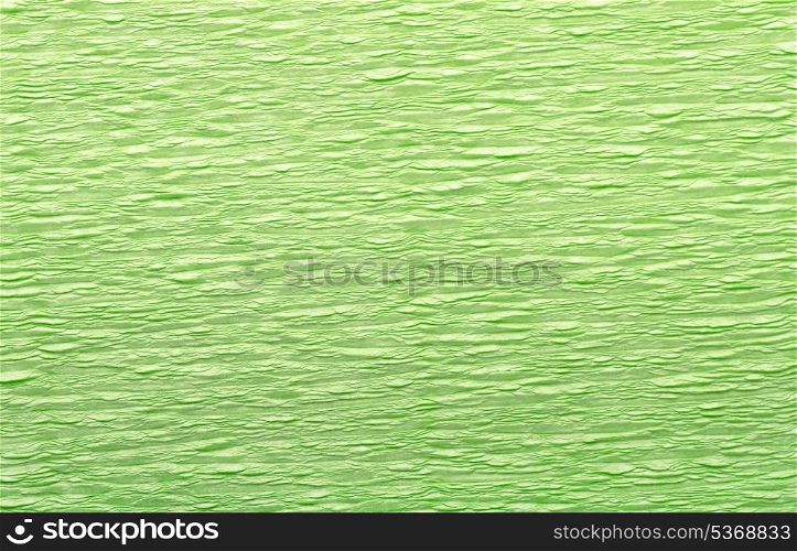 Green wrinkled crepe paper background