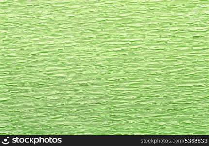 Green wrinkled crepe paper background