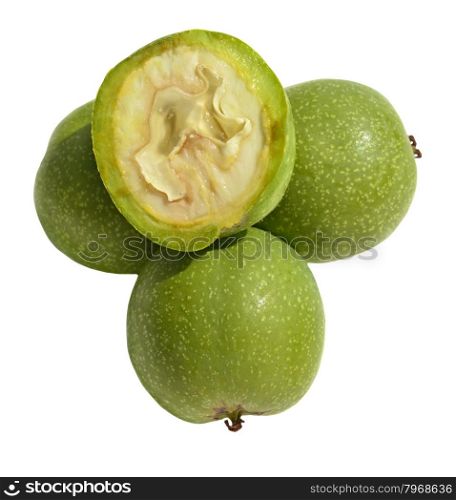 Green young walnuts in husks on white background