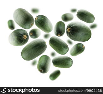 Green zucchini in the shape of a heart on a white background.. Green zucchini in the shape of a heart on a white background