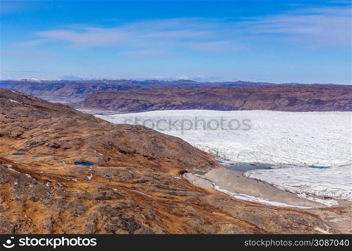 Greenlandic tundra landscape with ice cap melting, aerial view, near Kangerlussuaq, Greenland