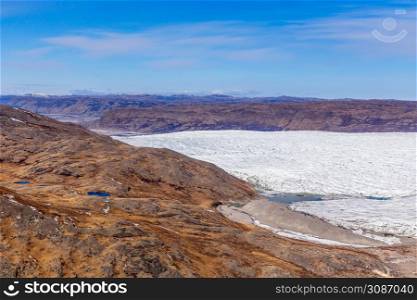Greenlandic tundra landscape with ice cap melting, aerial view, near Kangerlussuaq, Greenland