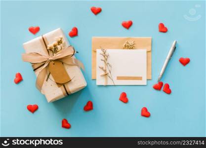 Greeting card and gift boxs with red heart on blue background, copy space for text
