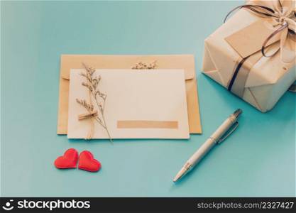 Greeting card and gift boxs with red heart on blue background, copy space for text