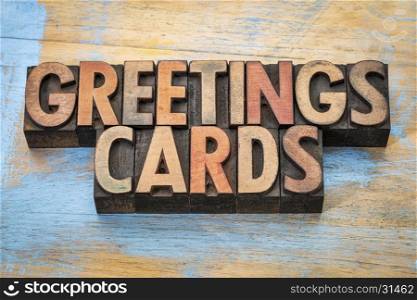 greetings cards - word abstract in vintage letterpress wood type blocks against grunge wood