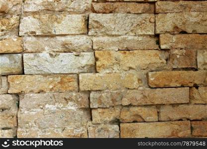 Grey bricks in the wall. Background texture