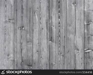 grey brown part of vertical planks on wooden shed or barn