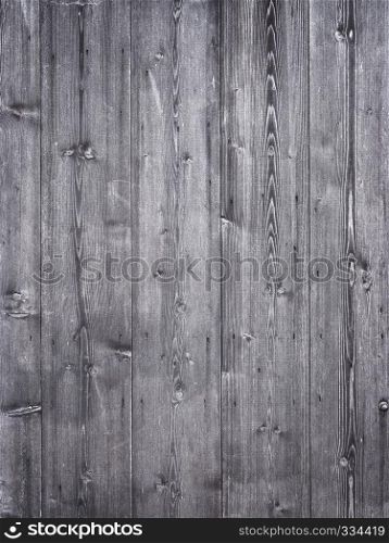 grey brown part of vertical planks on wooden shed or barn