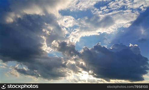 Grey clouds and sunlight on sky background