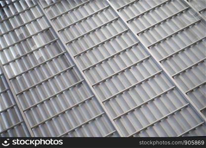Grey corrugated metal sheet for industrial building.