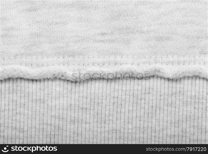 Grey fabric texture with horizontal stitch. Clothes background. Fabric texture with stitch
