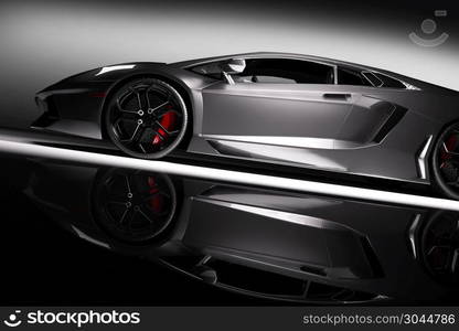 Grey fast sports car in spotlight, black background. Shiny, new, luxurious. 3D rendering. Grey fast sports car in spotlight, black background. Shiny, new, luxurious.