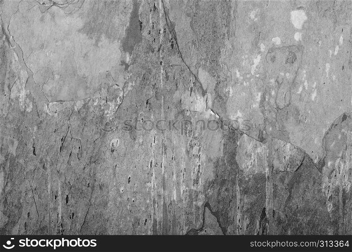 Grey grunge stone texture background with white cracks