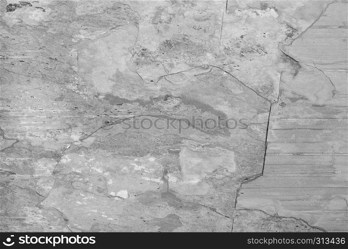 Grey grunge stone texture background with white cracks