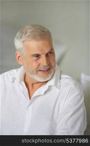 Grey-haired man giving advise