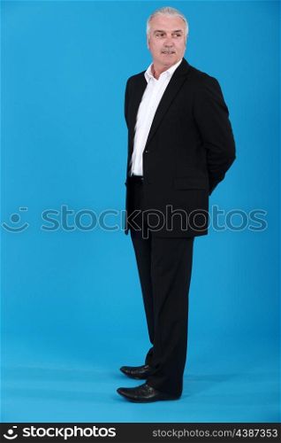 Grey haired man in suit