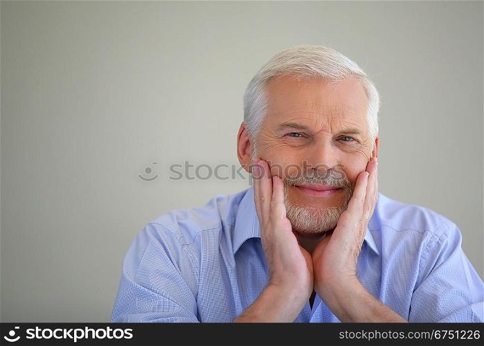 Grey-haired man thinking back on his life