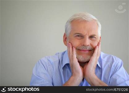Grey-haired man thinking back on his life