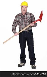 Grey-haired man with shovel
