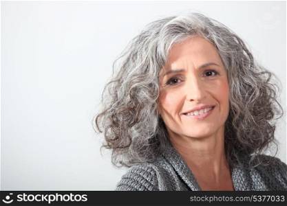 Grey-haired woman on white background